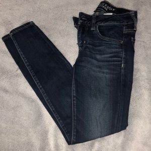 Dark wash skinny jeans.